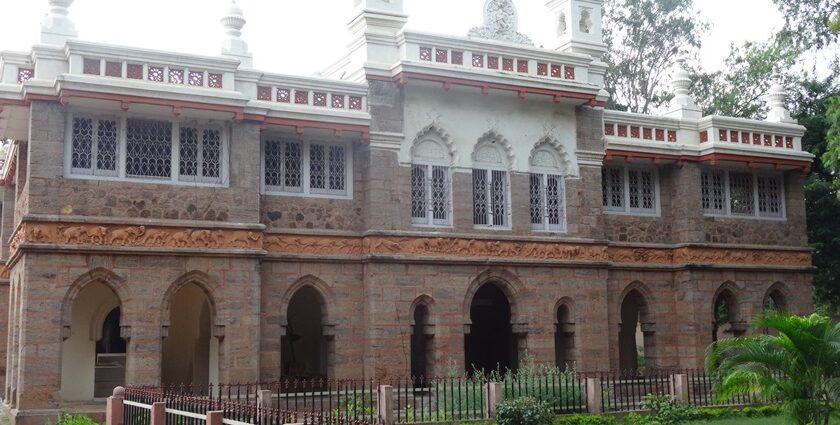 A breathtaking view of a historical monument surrounded by a lawn during the daytime.