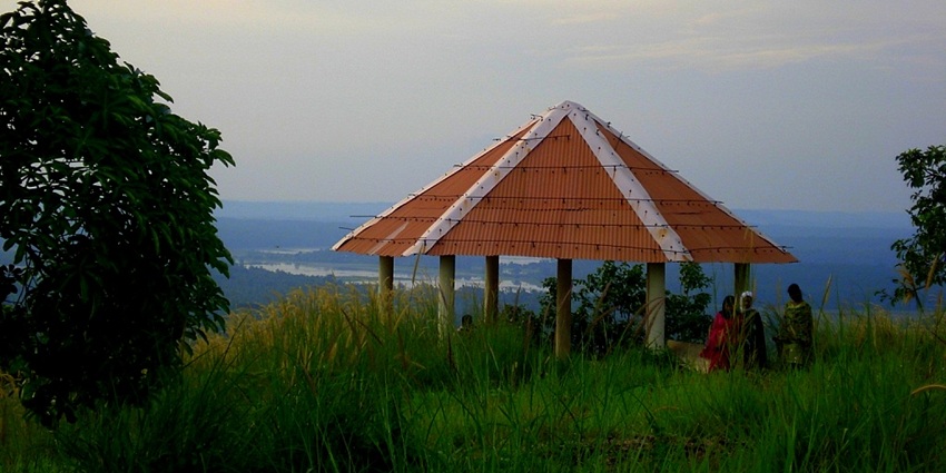 A majestic view of a lush green hill with a canopy for sightseeing