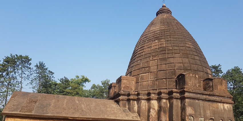 A Doul temple in Assam with tall shikhara, ornate carvings, and sacred presence.