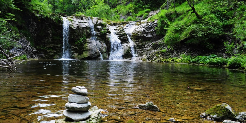 Image of a scintillating waterfall amidst the lush dense forest in the majestic valley–Things to do in Araku Valley