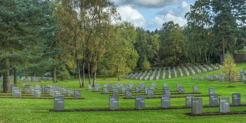 Rows of white gravestones at Imphal War Cemetery, a peaceful memorial honouring soldiers.