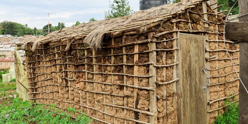 A traditional straw hut, showcasing rustic construction with a thatched roof and natural materials