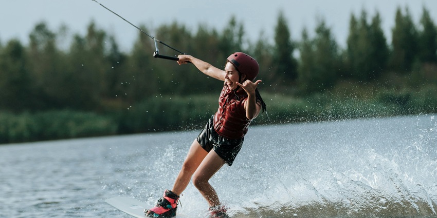 A woman wakeboardin in the river
