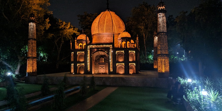 A replica of the Taj Mahal adorned with glistening lights at the Waste to Wonder Park.