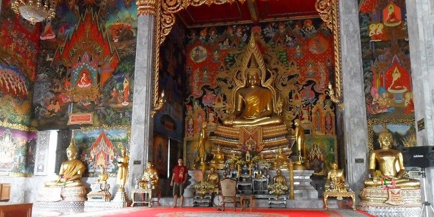 A picture taken inside a Thai Buddhist temple showing the giant Buddha statue