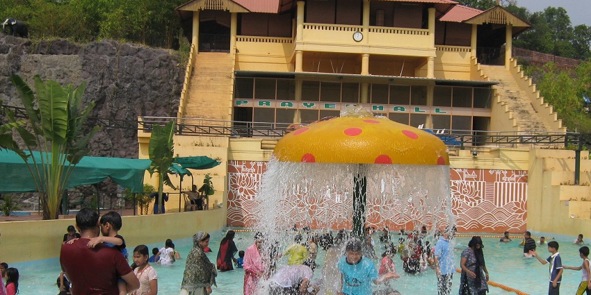 People enjoying the rain dance section of a water park in Wayanad