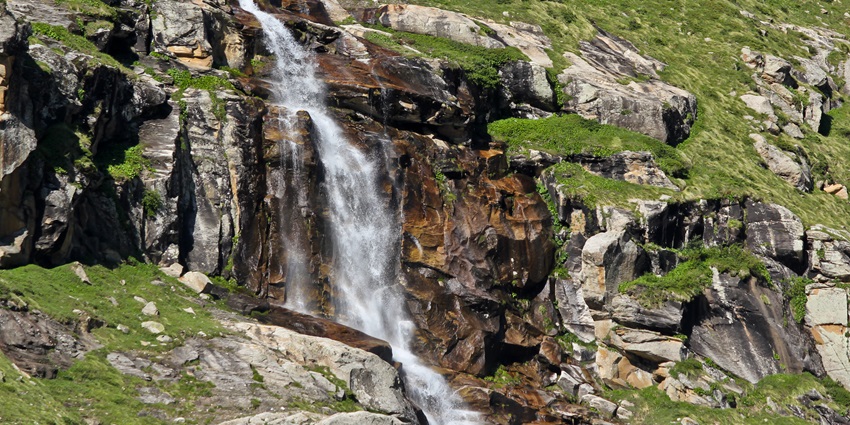 Immerse into the enchanting views of the water descending down the rocks of this waterfall