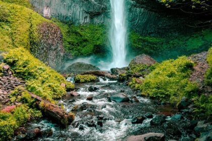 A breathtaking view of shimmering waters cascading down from the majestic peaks.