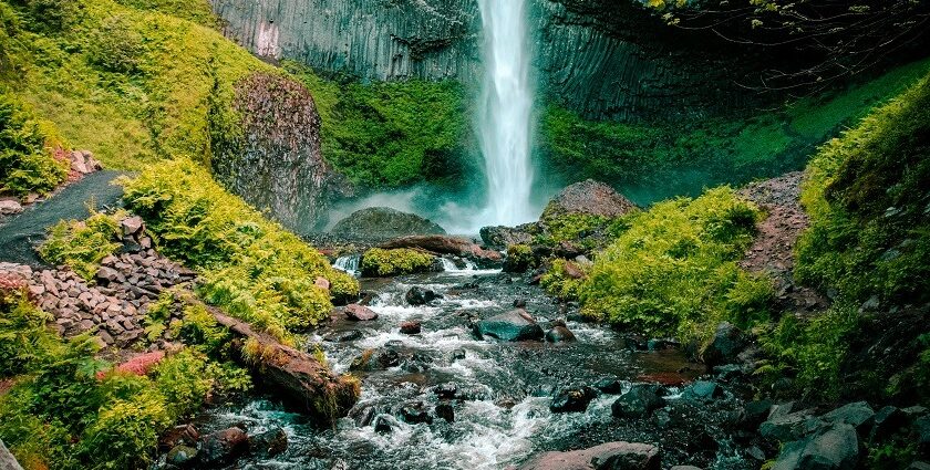 A breathtaking view of shimmering waters cascading down from the majestic peaks.