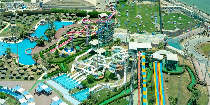 Aerial view of a waterpark with winding slides, pools - places to visit with family.