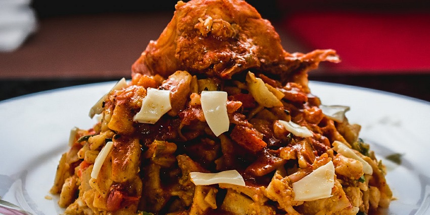 An image of Kottu Roti which is a famous food made in Sri Lanka and a must-try dish.