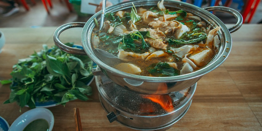 An image used for representation of Vegetable Soup with Meat in stainless steel bowl.