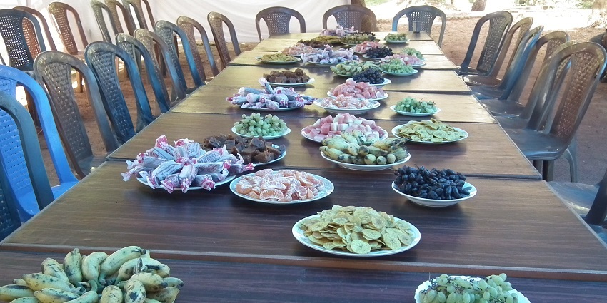 A picture of food being served at a table in a restaurant