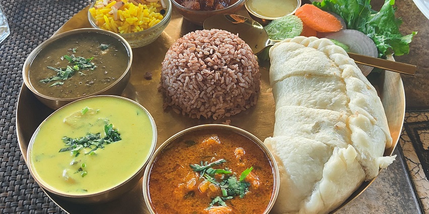Gorge on the appetising local dishes of Kullu, on your visit to Manu Temple.