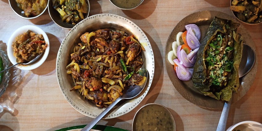 Savour the delicious dishes of Assam, India on your visit to Kakoijana National Park.
