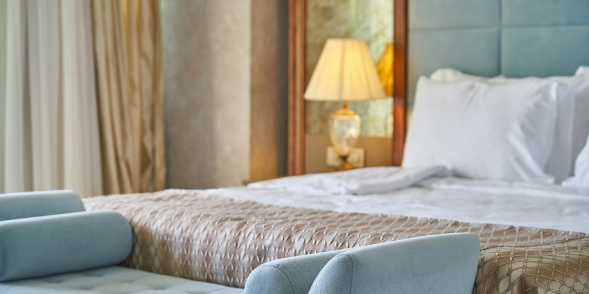 Image of a cosy modern-style bedroom, an accommodation near the Temple in Guruvayur.