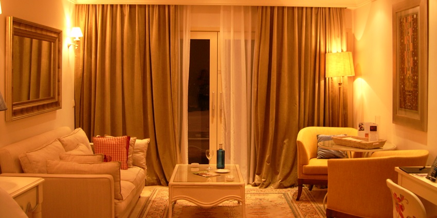 The view of a cosy hotel room with a comfortable bed, and stylish furnishings in a hotel.