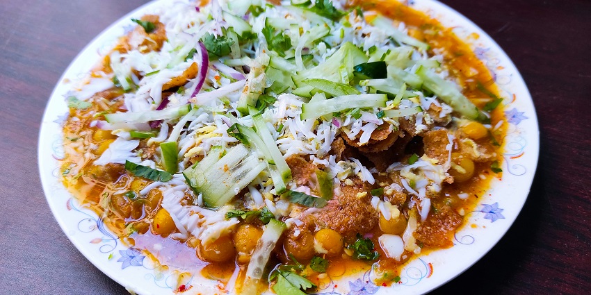A mouth watering view of a delicious dish served on a plate and garnished with greens.