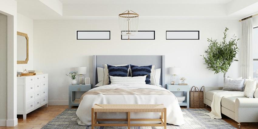 A stunning view of a bed lined with white sheets and a white couch on the side of it.