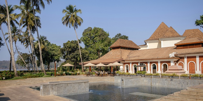 A breathtaking view from a hotel in goa with a body of water in front during the day.