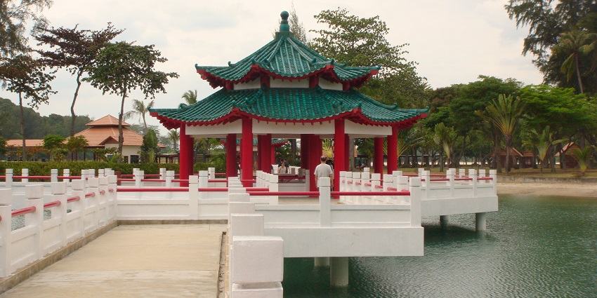 Wishing Well at Kusu Island, a serene spot surrounded by greenery, a tranquil atmosphere.