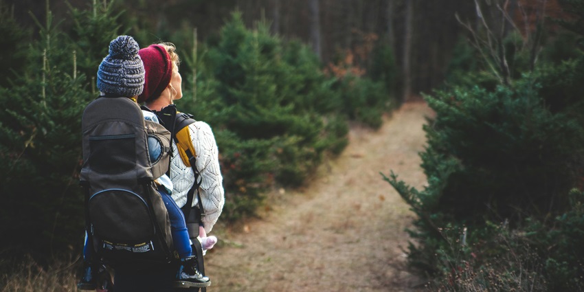 Beautiful snapshot of a woman with her baby on the hiking trail—Hiking in Singapore