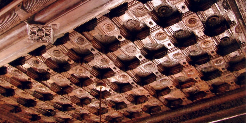 A beautifully carved wooden ceiling of a temple in Kerala