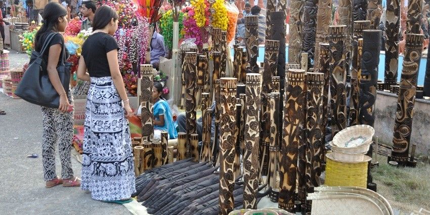 Tourists exploring the handicrafts at the shop in Port Blair, display of the talent and creativity