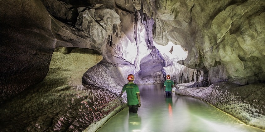 A mesmerizing cave entrance with stalactites, a hidden gem among caves in Manipur.