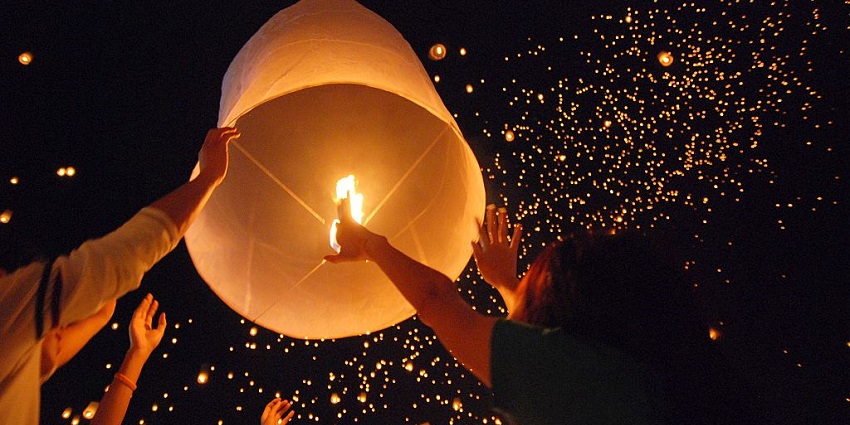 A beautiful view of lanterns in the night sky at Yi Peng Lantern Festival at Chiang Mai