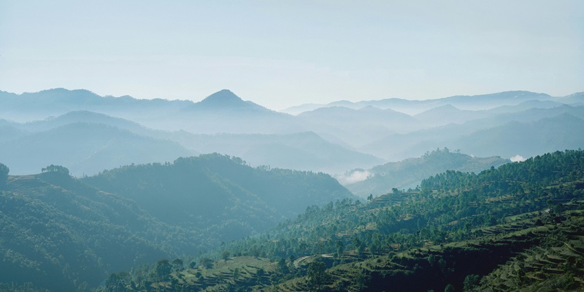 Scenic views from the tranquil highland terrain covered in the chill mist of clouds