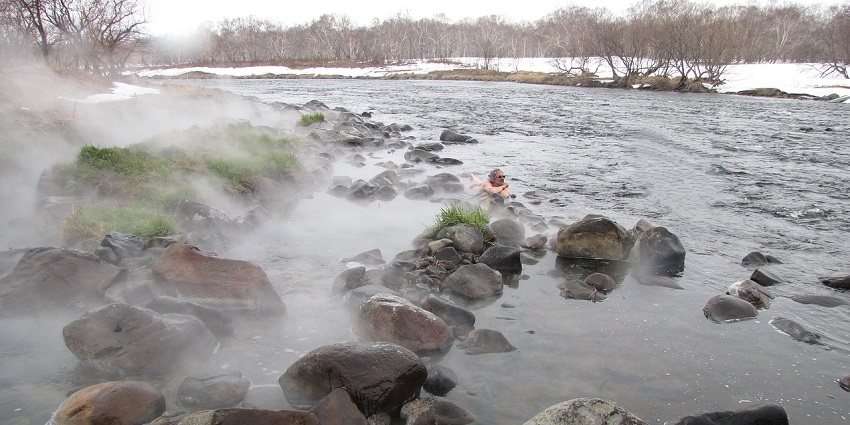 The overwhelming view of Zee-ro Hot Spring over a river stream in winter in Sikkim, India.