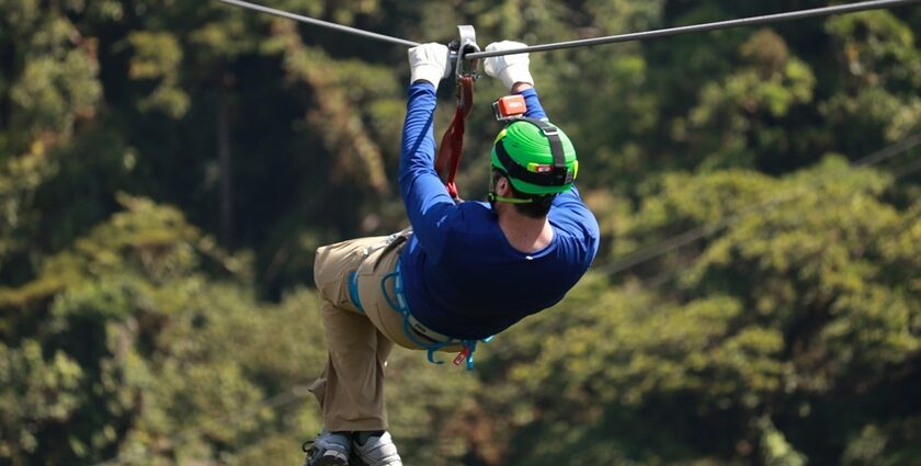 Scenic image of a man participating in the zipline adventure spot in E-O-D adventure park