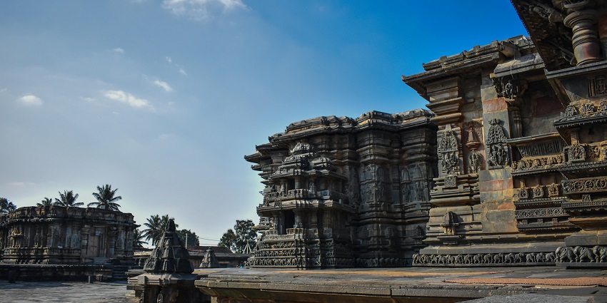 Historic step well in Penukonda, India, featuring detailed stone carvings and deep structure.