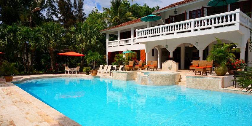 A tranquil swimming pool at a farmhouse in Delhi with an energetic ambience