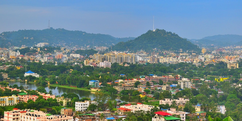 Guwahati's city skyline at dusk, blending urban development with natural beauty.