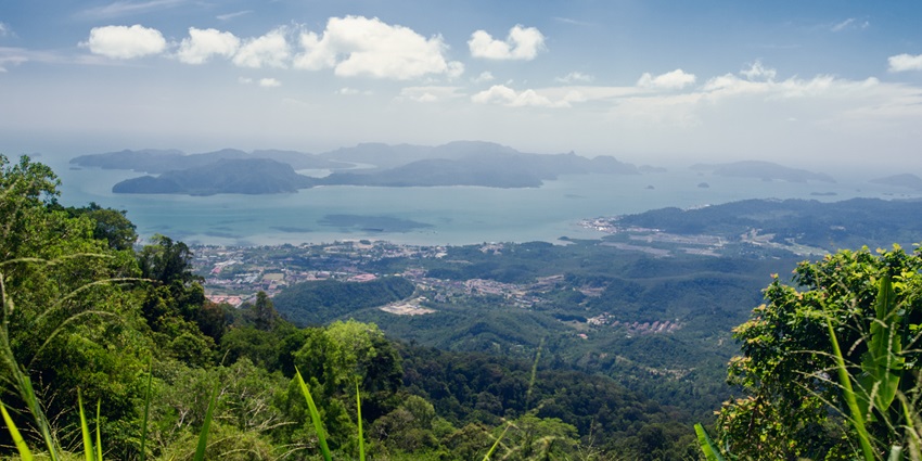 Gunung Raya, the highest peak in Langkawi showcasing misty mountains and the distant ocean.
