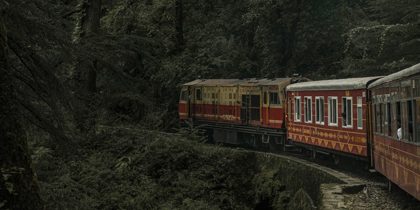 A marvellous view of the Toy Train moving across the lush green mountains of Shimla in May