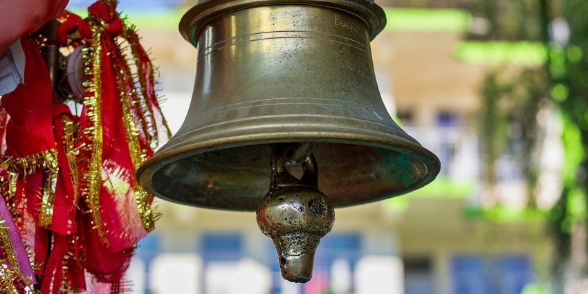 Inside view of a Mandir with a temple bell - visit Banjari Mata Mandir in Chhattisgarh.