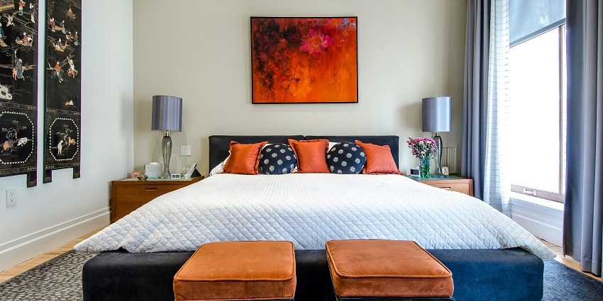 A cosy quilted white comforter draped elegantly over a neatly made bed, inviting relaxation.