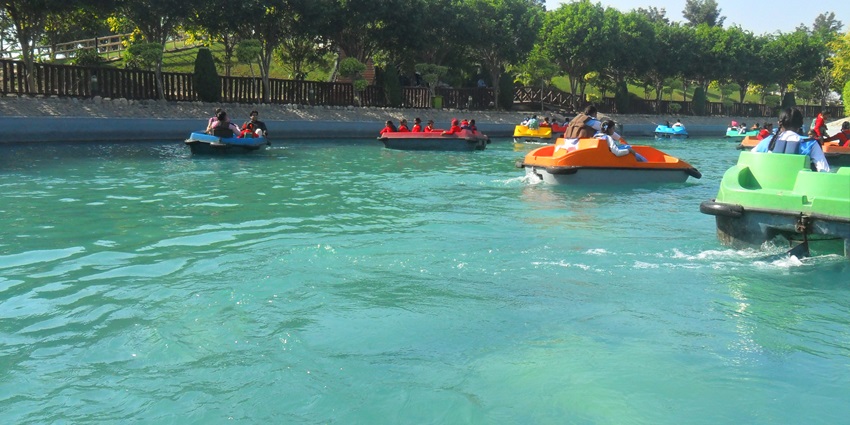 Image of lake water people riding boat and enjoying the nature in AATAPI Wonderland