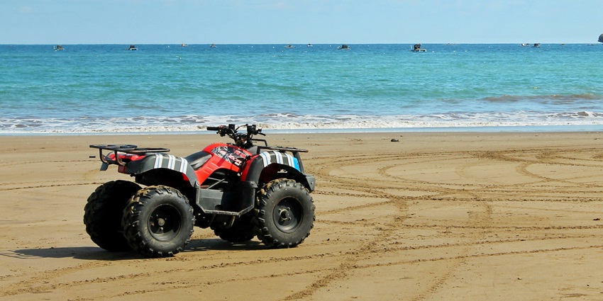 Image of ATV(All-Terrain Vehicle) Ride near the sea during day time fun with family and friends