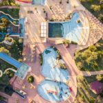 A bird’s eye view of the leisure hub in Gujarat featuring serene pools and rides.