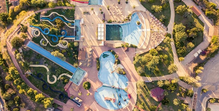 A bird’s eye view of the leisure hub in Gujarat featuring serene pools and rides.