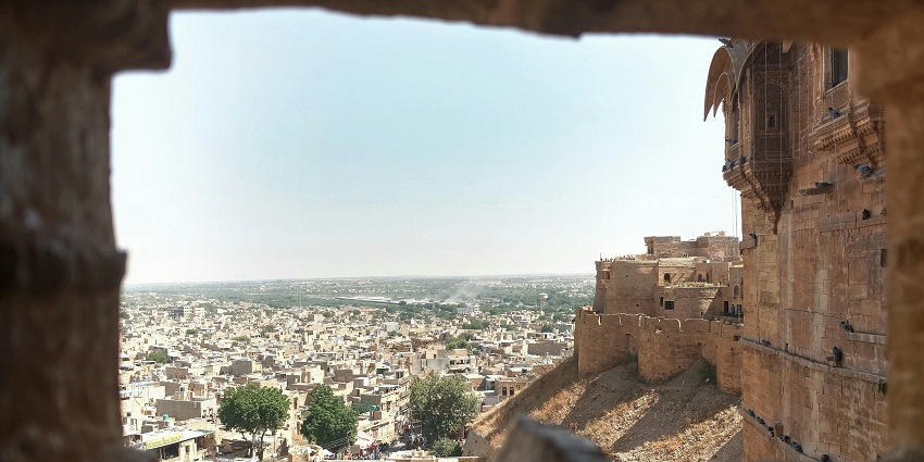 Aerial view of ancient stone fortress with old city district during day time