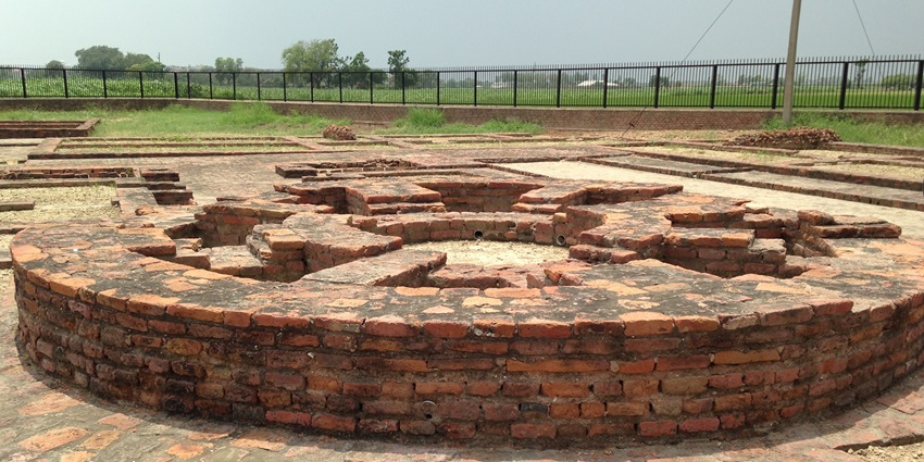 A mesmerising view of the remains of Budhhist stupa in Punjab surrounded by lush greenery.