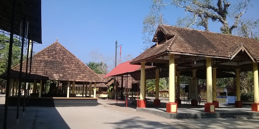 The traditional architecture exterior of a Devi temple during a bright sunny day in India.