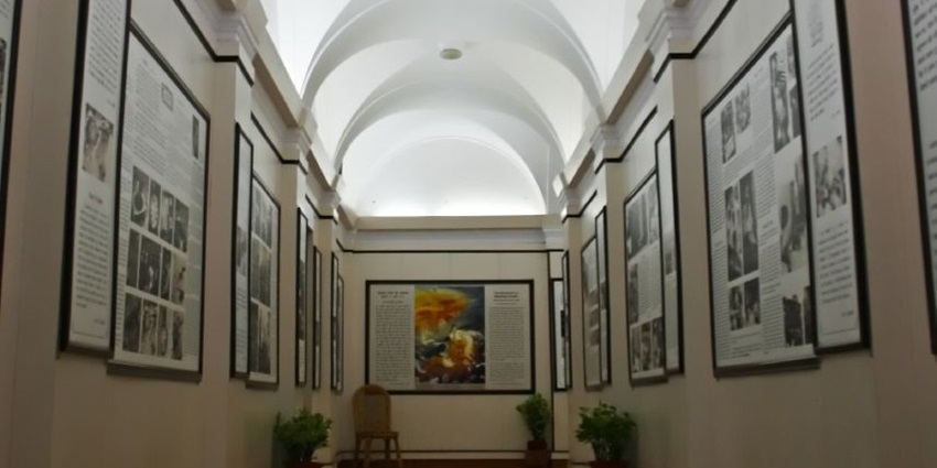 An inside view of the Gandhi Smriti Museum in Delhi featuring a majestic statue.