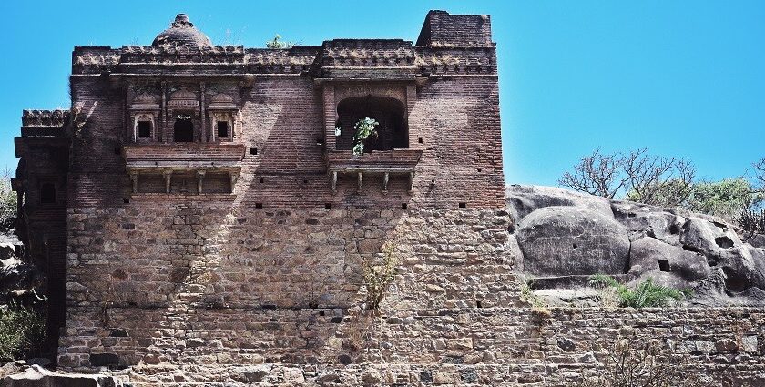 A serene view of the Achalgarh Fort in Mount Abu, surrounded by natural beauty and hills.