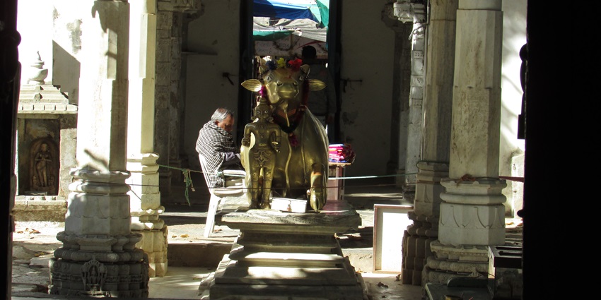 A close-up image of the intricately carved Nandi statue at Achalgarh Temple in Achalgarh Fort.